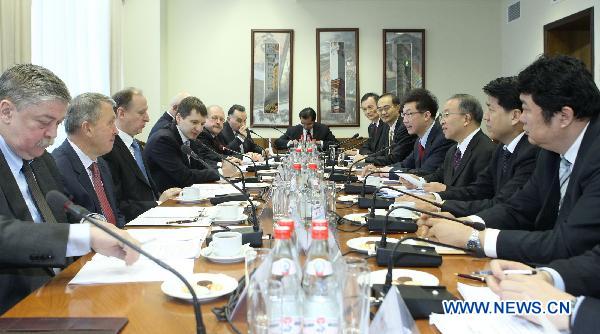 Russia's Security Council Secretary Nikolai Patrushev (3rd L) meets with visiting Chinese State Councilor Dai Bingguo (3rd R), who is in Mowcow for the fifth round of China-Russia strategic security talks, in Moscow, Russia, Jan. 24, 2011. [Lu Jinbo/Xinhua] 