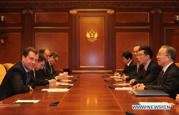 Russian President Dmitry Medvedev (1st L) meets with visiting Chinese State Councilor Dai Bingguo (1st R), who is here for the fifth round of China-Russia strategic security talks, in Moscow, Russia, Jan. 24, 2011. [Lu Jinbo/Xinhua]