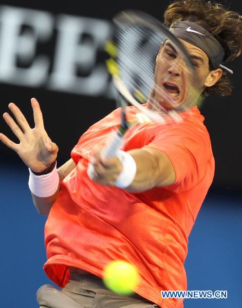 Rafael Nadal of Spain returns to Marin Cilic of Croatia during the men's singles fourth round match at the 2011 Australian Open tennis tournament in Melbourne, Australia, Jan. 24, 2011. (Xinhua/Meng Yongmin) 