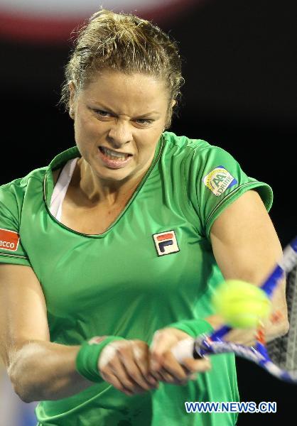 Kim Clijsters of Belgium returns to Ekaterina Makarova of Russia during the fourth round match of women's singles at the Australian Open tennis tournament in Melbourne Jan. 24, 2011. Kim Clijsters won 2-0. (Xinhua/Meng Yongmin) 