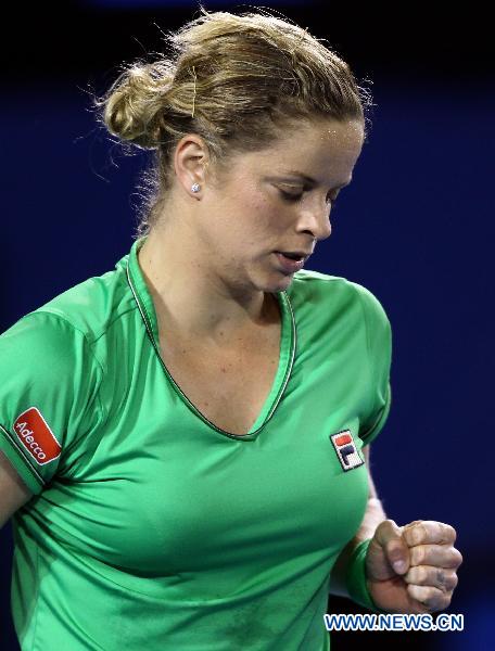 Kim Clijsters of Belgium celebrates for a score during the fourth round match of women's singles against Ekaterina Makarova of Russia at the Australian Open tennis tournament in Melbourne Jan. 24, 2011. Kim Clijsters won 2-0. (Xinhua/Meng Yongmin)