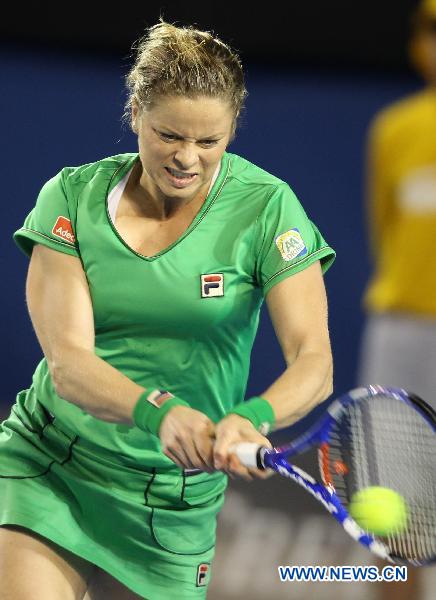 Kim Clijsters of Belgium returns to Ekaterina Makarova of Russia during the fourth round match of women's singles at the Australian Open tennis tournament in Melbourne Jan. 24, 2011. Kim Clijsters won 2-0. (Xinhua/Meng Yongmin)