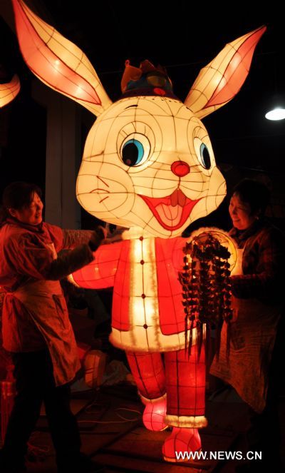 Craftswomen trim rabbit-shaped lanterns in a lantern factory in Suzhou, east China's Jiangsu province, Jan. 23, 2011. The Chinese Lunary New Year began on Feb. 3 this year and it will be the year of the rabbit, one of the twelve Chinese zodiac animals. [Xinhua/Zhu Guigen] 