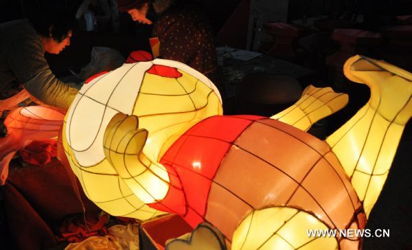 Craftswomen trim rabbit-shaped lanterns in a lantern factory in Suzhou, east China's Jiangsu province, Jan. 23, 2011. The Chinese Lunary New Year began on Feb. 3 this year and it will be the year of the rabbit, one of the twelve Chinese zodiac animals. [Xinhua/Zhu Guigen] 