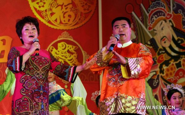 Singer Wang Yuqing (R, front) and Zhan Anna perform at the New York 2011 Chinese New Year Gala in Flushing, New York, the United States, Jan. 22, 2011. Chinese Americans gathered on Saturday in China Town in New York to celebrate the Chinese Spring Festival which falls on Feb. 3, 2011 this year. 