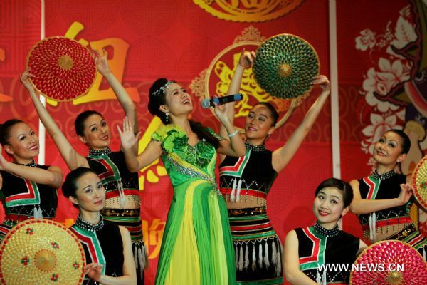 Singer He Yi (front) performs at the New York 2011 Chinese New Year Gala in Flushing, New York, the United States, Jan. 22, 2011. Chinese Americans gathered on Saturday in China Town in New York to celebrate the Chinese Spring Festival which falls on Feb. 3, 2011 this year.
