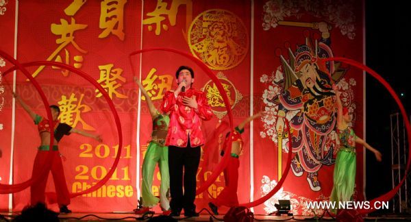 Singer Zhao Chunsheng (front) performs at the New York 2011 Chinese New Year Gala in Flushing, New York, the United States, Jan. 22, 2011. Chinese Americans gathered on Saturday in China Town in New York to celebrate the Chinese Spring Festival which falls on Feb. 3, 2011 this year. 