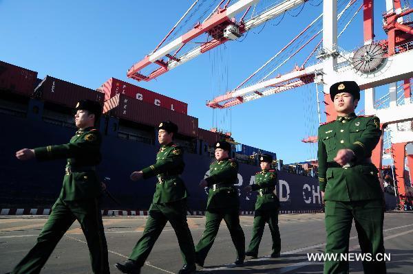 Frontier defence force of Bayuquan checkpoint patrol in Yingkou port, northeast China&apos;s Liaoning Province, Jan. 24, 2011. The transportation and production at the sea of Liaoning Province are affected by sea ice due to freezing weather. 