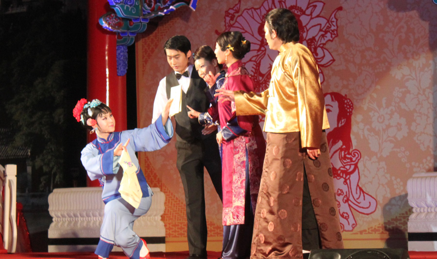 The matchmaker (left) discusses wedding details with the couple's parents.