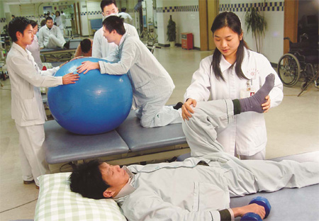 A patient undergoes physiotherapy treatment at the Work Injury Rehabilitation Center in Guangzhou, Guangdong province. The center was the first of its kind on the Chinese mainland and can treat 200 patients at a time. 