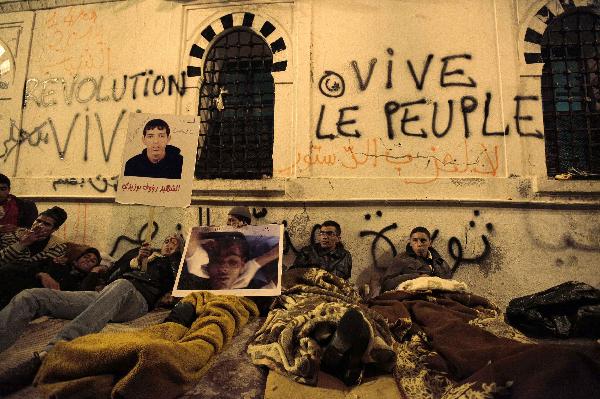 Protesters from Tunisia&apos;s marginalised rural heartlands prepare to spend their second night outside the Prime Minister&apos;s office in Tunis January 24, 2011. Protesters demonstrated in the capital on Sunday to demand that the revolution they started should now sweep the remnants of the fallen president&apos;s old guard from power. [Xinhua] 