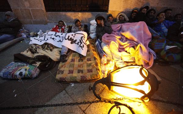 Protesters from Tunisia&apos;s marginalised rural heartlands are seen as they prepare to spend their second night outside the Prime Minister&apos;s office in Tunis January 24, 2011. Protesters demonstrated in the capital on Sunday to demand that the revolution they started should now sweep the remnants of the fallen president&apos;s old guard from power. [Xinhua]