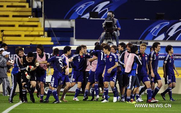 Players of Japan celebrate the victory after the semifinal match between Japan and South Korea at the Asian Cup in Doha, capital of Qatar, Jan. 25, 2011. Japan defeated South Korea 3-0 on penalties after a 2-2 draw to reach the Asian Cup final. (Xinhua/Tao Xiyi) 