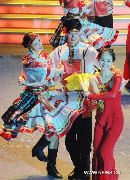 Chinese and Russian dancers perform in Heihe, northeast China's Heilongjiang Province, Jan. 24, 2011, to greet the upcoming Chinese Spring Festival which falls on Feb. 3 this year. 