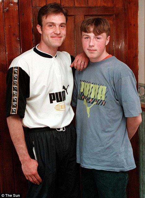 Previous record: Steve Smith, left, with son Dale in 1997. Mr Smith was also 29 when his son Dale became a father at age 14