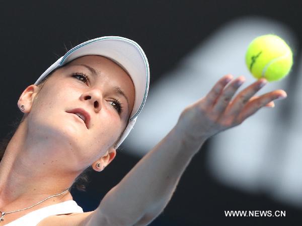 Agnieszka Radwanska of Poland serves the ball during the women's singles quarter-final match against Kim Clijsters of Belgium at the Australian Open tennis tournament in Melbourne, Australia, on Jan. 26, 2011. Clijsters won 2-0 to enter the semifinals. (Xinhua/Meng Yongmin) 