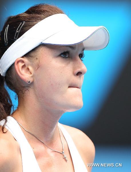 Agnieszka Radwanska of Poland reacts during the women's singles quarter-final match against Kim Clijsters of Belgium at the Australian Open tennis tournament in Melbourne, Australia, on Jan. 26, 2011. Clijsters won 2-0 to enter the semifinals. (Xinhua/Meng Yongmin) 