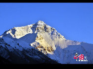 Mount Qomolangma, also called Mt. Everest, is the highest peak in the world. Its Tibetan meaning of 'Goddess the Third' adds more mysterious color and magic power to the subject. The altitude of Mt. Everest is now about 8,844.43 m. (29,017 ft.). It is the dominant peak of Himalayas, the northern brae in Tingri County of Tibet and the southern in the Nepal. [Photo by Chen Zhu]