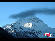 Mount Qomolangma, also called Mt. Everest, is the highest peak in the world. Its Tibetan meaning of 'Goddess the Third' adds more mysterious color and magic power to the subject. The altitude of Mt. Everest is now about 8,844.43 m. (29,017 ft.). It is the dominant peak of Himalayas, the northern brae in Tingri County of Tibet and the southern in the Nepal. [Photo by Chen Zhu]