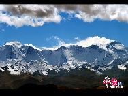 Mount Qomolangma, also called Mt. Everest, is the highest peak in the world. Its Tibetan meaning of 'Goddess the Third' adds more mysterious color and magic power to the subject. The altitude of Mt. Everest is now about 8,844.43 m. (29,017 ft.). It is the dominant peak of Himalayas, the northern brae in Tingri County of Tibet and the southern in the Nepal. [Photo by Chen Zhu]