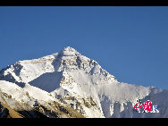 Mount Qomolangma, also called Mt. Everest, is the highest peak in the world. Its Tibetan meaning of 'Goddess the Third' adds more mysterious color and magic power to the subject. The altitude of Mt. Everest is now about 8,844.43 m. (29,017 ft.). It is the dominant peak of Himalayas, the northern brae in Tingri County of Tibet and the southern in the Nepal. [Photo by Chen Zhu]