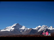 Mount Qomolangma, also called Mt. Everest, is the highest peak in the world. Its Tibetan meaning of 'Goddess the Third' adds more mysterious color and magic power to the subject. The altitude of Mt. Everest is now about 8,844.43 m. (29,017 ft.). It is the dominant peak of Himalayas, the northern brae in Tingri County of Tibet and the southern in the Nepal. [Photo by Chen Zhu]