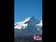 Mount Qomolangma, also called Mt. Everest, is the highest peak in the world. Its Tibetan meaning of 'Goddess the Third' adds more mysterious color and magic power to the subject. The altitude of Mt. Everest is now about 8,844.43 m. (29,017 ft.). It is the dominant peak of Himalayas, the northern brae in Tingri County of Tibet and the southern in the Nepal. [Photo by Chen Zhu]