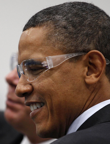 US President Barack Obama wears safety glasses at Orion Energy Systems, a power technology company, as part of his administration&apos;s White House to Main Street Tour in Manitowoc, Wisconsin, Jan 26, 2011. [China Daily/Agencies]
