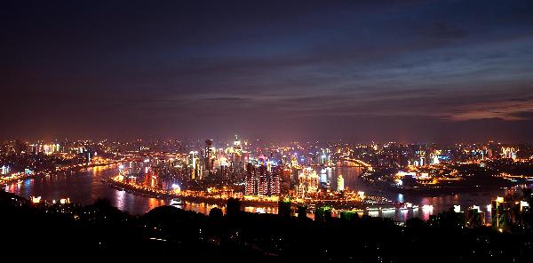 File photo taken on July. 23, 2010 shows the bird&apos;s eye view of downtown Chongqing, southwest China&apos;s Municipality. The State Council, China&apos;s cabinet, has approved on a trial basis the launch of property tax reforms in some cities. Shanghai and Chongqing are cities that will trial the tax first. Chongqing sets its property tax rate at 0.5 to 1.2 percent. [Xinhua]