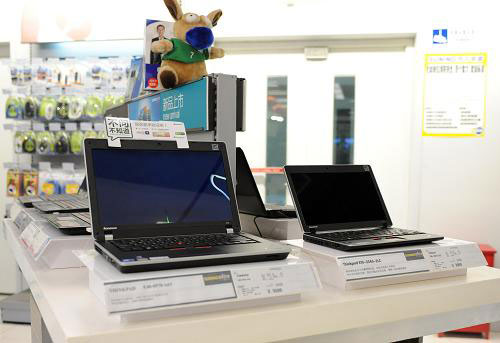 This photo taken on Thursday, January 27, 2011 shows laptops in an electronics and appliance store in Beijing. [Xinhua]