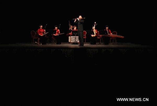 Chinese musicians perform traditional Chinese folk music in Paris, capital of France, Jan. 27, 2011. A concert celebrating upcoming Chinese lunar new year was performed by musicians from China's Shanghai Traditional Music Orchestra here on Thursday.