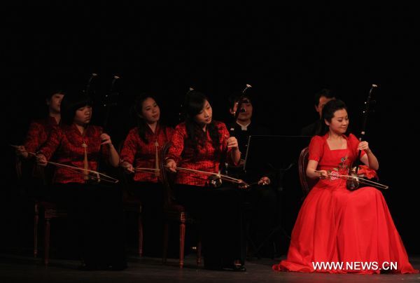 Chinese musicians perform traditional Chinese folk music in Paris, capital of France, Jan. 27, 2011. A concert celebrating upcoming Chinese lunar new year was performed by musicians from China's Shanghai Traditional Music Orchestra here on Thursday.