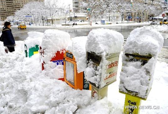 Mailboxes are covered by snow in New York, the United States, Jan. 27, 2011. New York Mayor Michael Bloomberg announced on Thursday that the city had experienced the snowiest January in history after a thick blanket of snow covered the city. (Xinhua