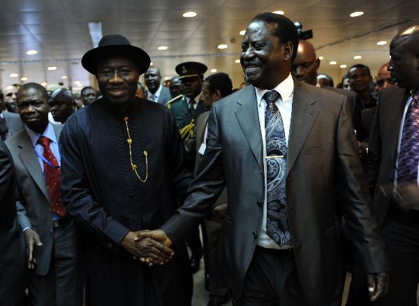 Kenya's Prime Minister Raila Odinga (R) shakes hands with Nigerian President Jonathan Goodluck January 28, 2010 at the 16th ordinary session of the African Union, AU, in the Ethiopian capital, Addis Ababa. Odinga, the African Union mediator in the Ivory Coast political crisis on January 28, 2011 called for direct talks between presidential rivals Laurent Gbagbo and Alassane Ouattara. [Xinhua/AFP]