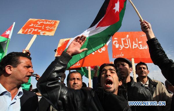 Jordanian protestors shout slogans during a sit-in held outside the prime minister's office in Amman, Jordan, on Jan. 29, 2011, calling for the formation of an interim government and the resignation of the government of Prime Minister Samir Rifai.[Mohammad Abu Ghosh/Xinhua]