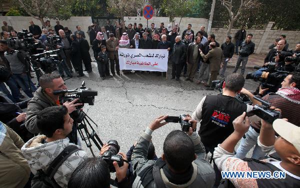 Jordanian activists hold a banner in support of the ongoing protests in Egypt against Hosni Mubarak's regime during a sit-in held in front of the Egyptian embassy in Amman, Jordan, on Jan. 29, 2011.[Mohammad Abu Ghosh/Xinhua]