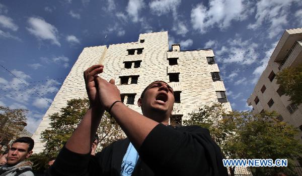 A Jordanian activist shouts slogans in support of the ongoing protests in Egypt against Hosni Mubarak's regime during a sit-in held in front of the Egyptian embassy in Amman, Jordan, on Jan. 29, 2011.[Mohammad Abu Ghosh/Xinhua]