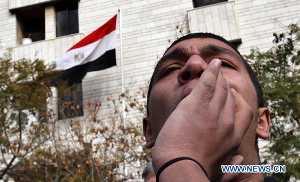 A Jordanian activist shouts slogans in support of the ongoing protests in Egypt against Hosni Mubarak's regime during a sit-in held in front of the Egyptian embassy in Amman, Jordan, on Jan. 29, 2011.[Mohammad Abu Ghosh/Xinhua]