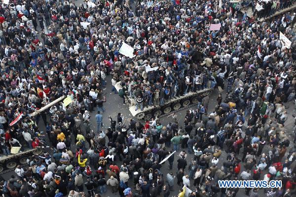 Demonstrators gather near the main Tahrir Square in Cairo, Egypt, Jan. 29, 2011. Tens of thousands of Egyptians defied a curfew and remained on the streets of downtown Cairo on Saturday, demanding the ouster of President Hosni Mubarak. [Cai Yang/Xinhua]