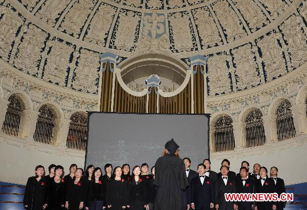 A chorus formed by visiting scholars from China perform during the Chinese New Year Gala held at the townhall of Oxford, UK, Jan. 28, 2011. 