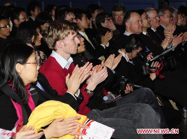 Students and scholars from both UK and China watch the Chinese New Year Gala held at the townhall of Oxford, UK, Jan. 28, 2011. 
