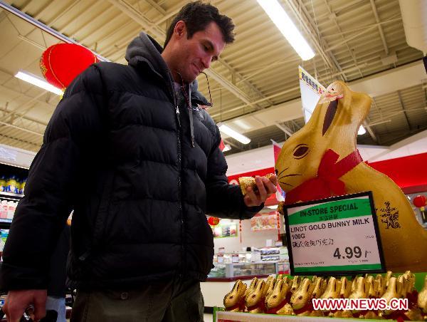 A customer looks at the goods for the upcoming Chinese Lunar New Year, or the Spring Festival, at a Chinese supermarket in Toronto, Canada, Jan. 28, 2011.
