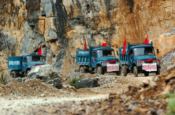 A file photo taken on March 23, 2010, shows trucks carrying water for drought-relief in Wenqian village of Dongshan county in South China&apos;s Guangxi province. 