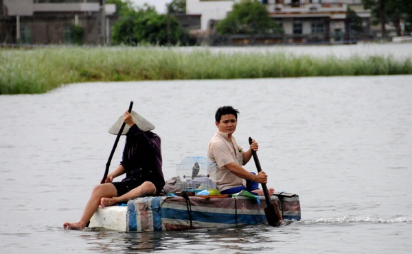 This file photo taken on Oct 6, 2010, shows Wancheng township hit by heavy rains in Wanning in South China&apos;s Hainan province. [Xinhua]