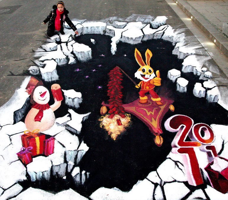 A citizen poses with a 3D street painting at Xuanwu Lake Park on January 30, 2011 in Nanjing, Jiangsu Province of China. [Photo/CFP]