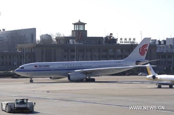 Photo taken on Jan. 31, 2011 shows an Airbus A330 chartered plane (L) at an airport in Beijing, capital of China. The chartered plane, which is able to carry 265 passengers, took off at 11:30 a.m. Monday, to evacuate Chinese citizens stranded in Cairo. Some 500 Chinese citizens were stranded at the airport in Cairo. [Ma Ruzhuang/Xinhua]