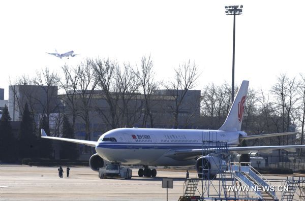 Photo taken on Jan. 31, 2011 shows an Airbus A330 charter plane at an airport in Beijing, capital of China. The charter plane, which is able to carry 265 passengers, took off at 11:30 a.m. Monday, to evacuate Chinese citizens stranded in Cairo. Some 500 Chinese citizens were stranded at the airport in Cairo. [Ma Ruzhuang/Xinhua]