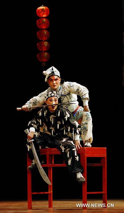 Chinese actors from the Wu Opera Troupe of Zhejiang Province perform at the Havana's National Theater in Havana, capital of Cuba, Jan. 29, 2011. Founded in 1956, the Wu Opera Troupe of Zhejiang has dedicated to rescuing and restoring the Wu opera, the second major theatrical genre in Zhejiang with a history of over 400 years.