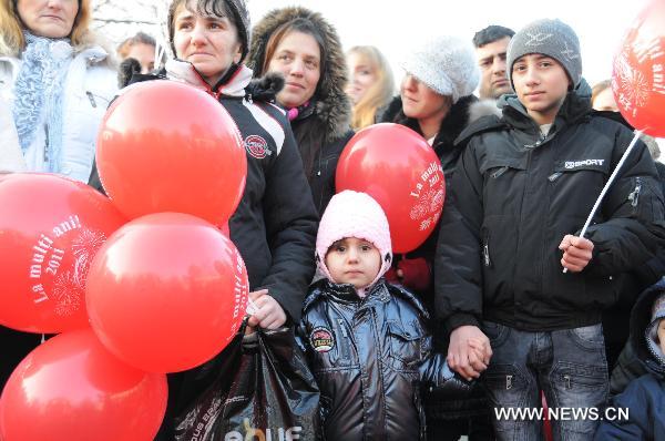 Romanians visit a Spring Festival fair in Bucharest, capital of Romania, Jan. 29, 2011. Chinese Embassy in Romania and Bucharest City hold a Spring Festival party at a park in Bucharest to celebrate the upcoming Chinese Lunar New Year, the year of rabbit.