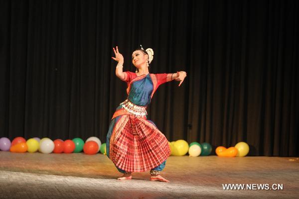 Chinese student Li Qianqian performs Indian dance during a Chinese Spring Festival Gala in New Delhi, India, on Jan. 29, 2011.